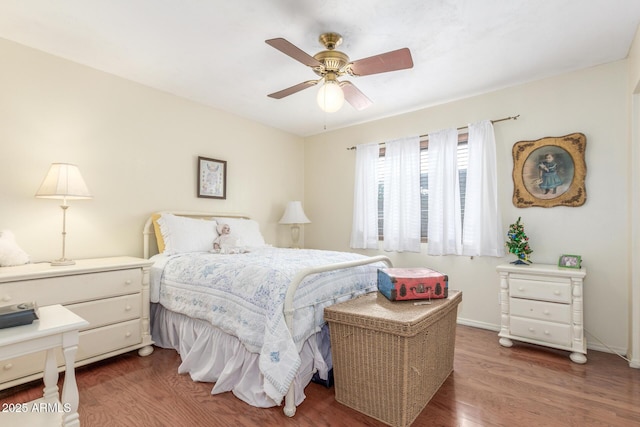 bedroom with ceiling fan and dark wood-type flooring