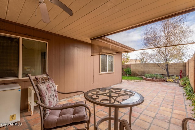 view of patio featuring ceiling fan