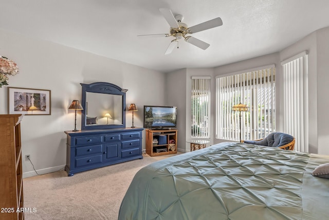 carpeted bedroom with access to outside and ceiling fan