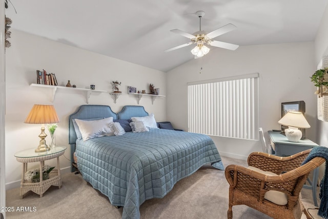 bedroom featuring vaulted ceiling, light carpet, and ceiling fan