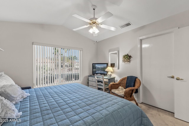 bedroom featuring lofted ceiling, light colored carpet, and ceiling fan