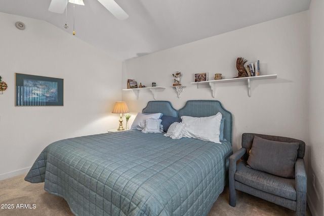 carpeted bedroom with vaulted ceiling and ceiling fan