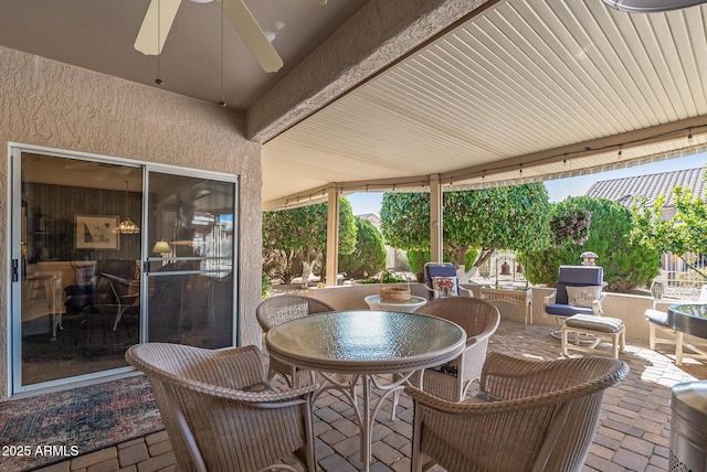 view of patio featuring ceiling fan