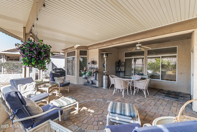 view of patio with a grill, an outdoor hangout area, and ceiling fan