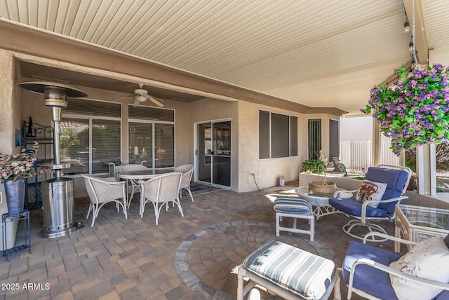 view of patio featuring ceiling fan