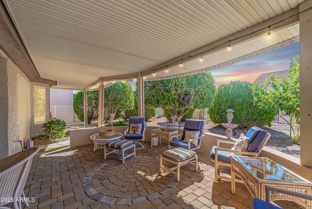 patio terrace at dusk with an outdoor hangout area