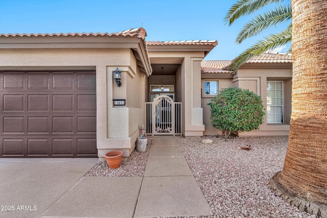 doorway to property with a garage