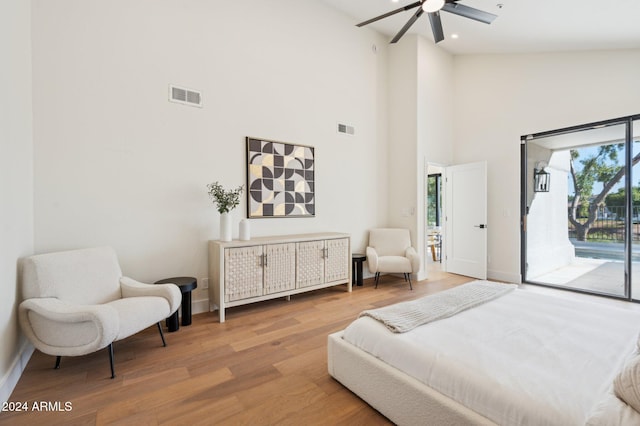 bedroom with high vaulted ceiling, ceiling fan, wood-type flooring, and access to outside