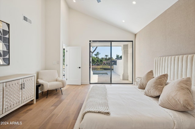 bedroom with light wood-type flooring, access to outside, and high vaulted ceiling