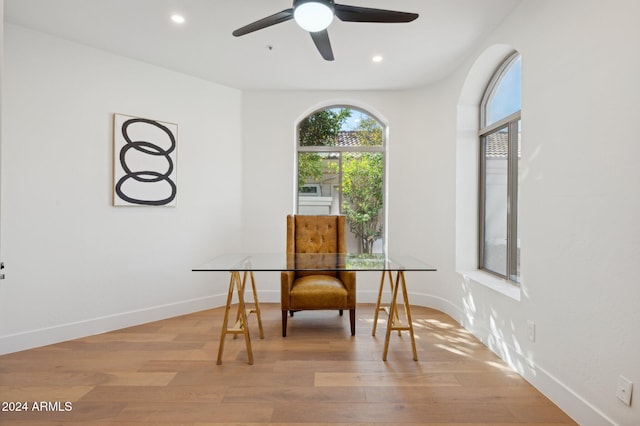 dining room featuring light hardwood / wood-style floors and ceiling fan