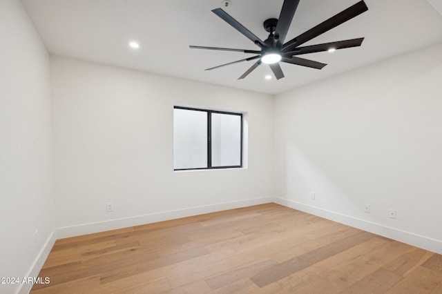 unfurnished room with light hardwood / wood-style flooring and ceiling fan