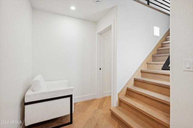 stairway with wood-type flooring