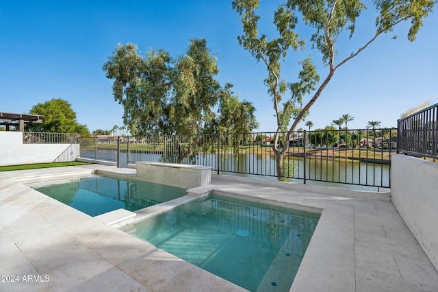 view of swimming pool with a water view