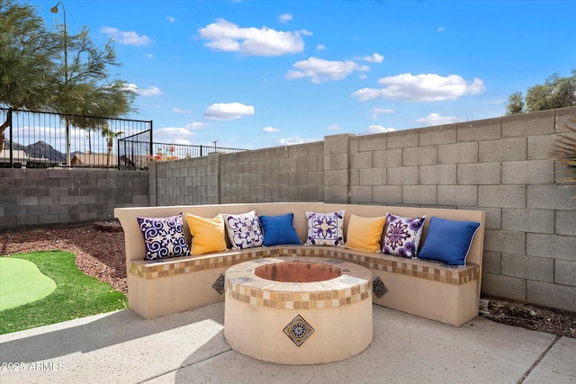 view of patio / terrace featuring fence and an outdoor fire pit