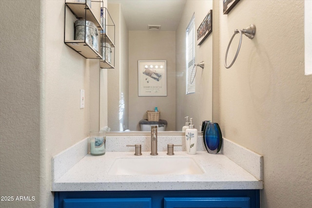 bathroom featuring visible vents and vanity