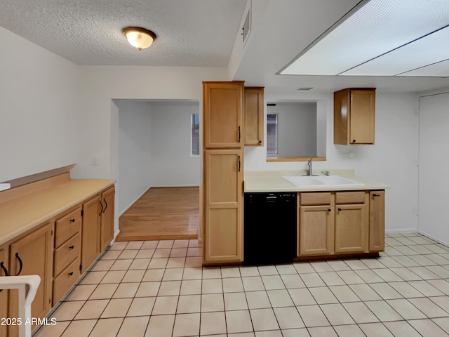 kitchen with dishwasher, a textured ceiling, light tile patterned flooring, and sink