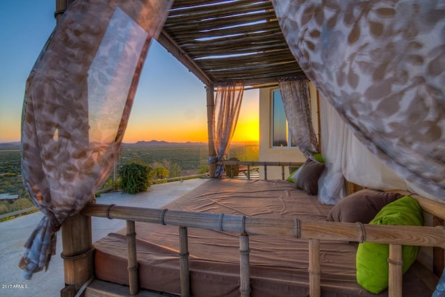 view of patio terrace at dusk