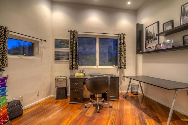 office with dark wood-type flooring