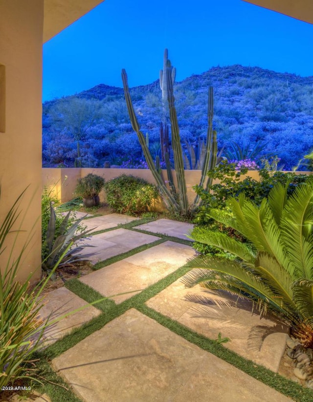 view of yard featuring a mountain view and a patio area