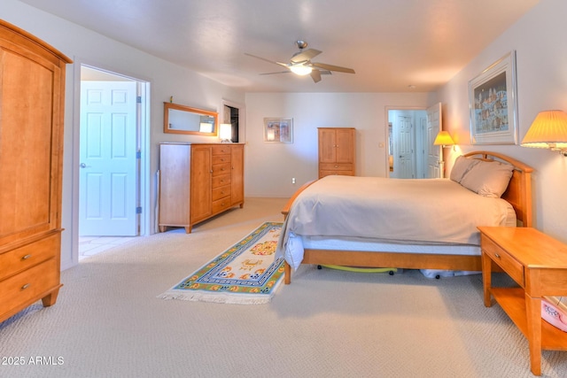 bedroom featuring light colored carpet and ceiling fan