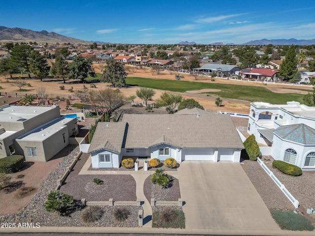 drone / aerial view featuring a mountain view and a residential view