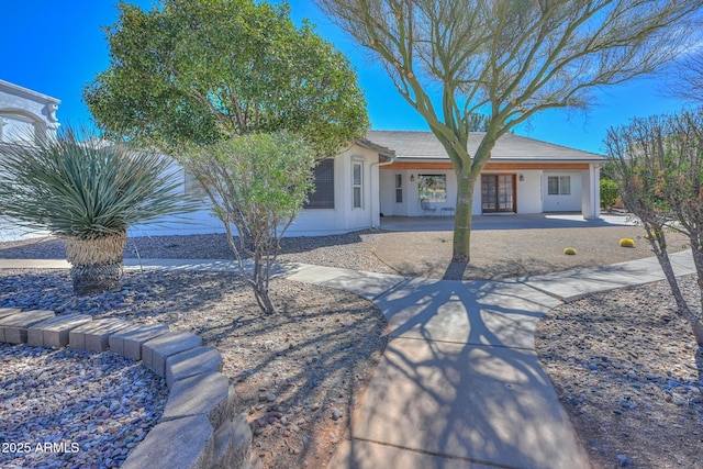 view of front of property with french doors and stucco siding