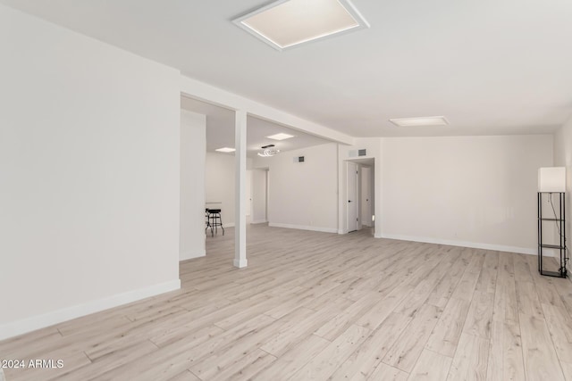 basement featuring light wood-type flooring