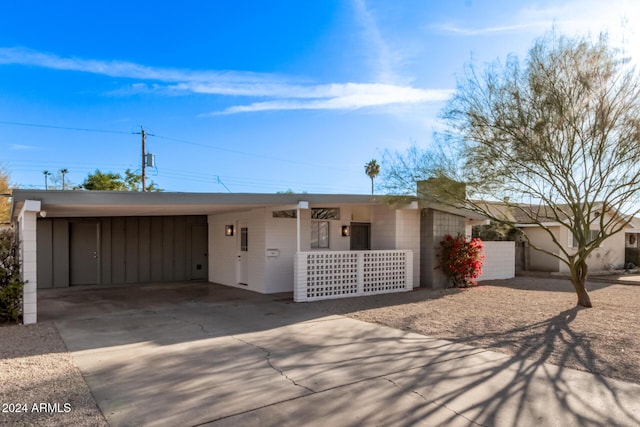 ranch-style house with a carport