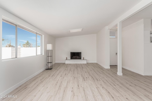 unfurnished living room with light hardwood / wood-style flooring