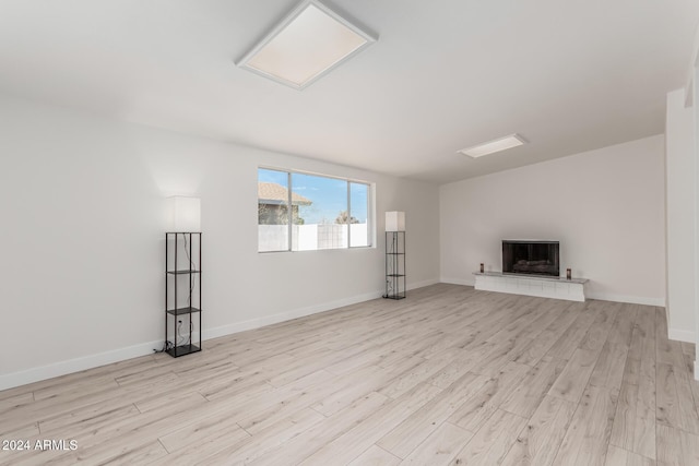 unfurnished living room featuring light hardwood / wood-style flooring