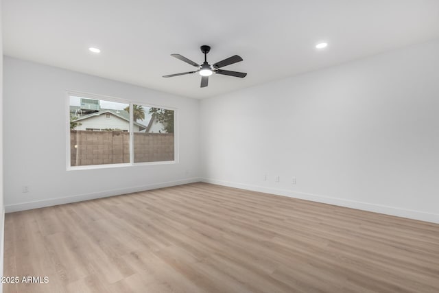 empty room with recessed lighting, baseboards, a ceiling fan, and light wood finished floors