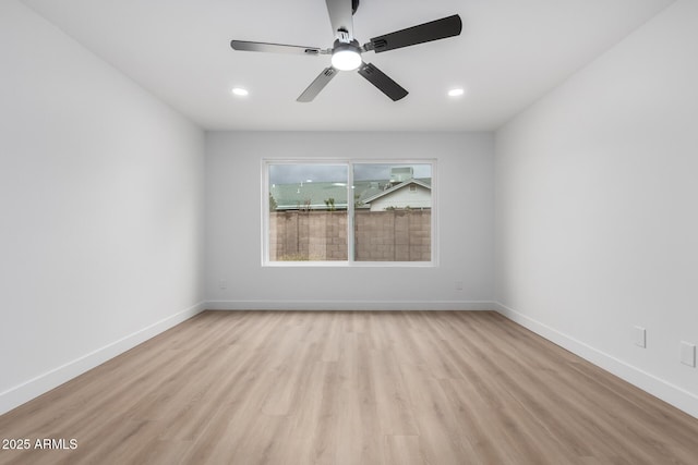 spare room with recessed lighting, baseboards, a ceiling fan, and light wood finished floors