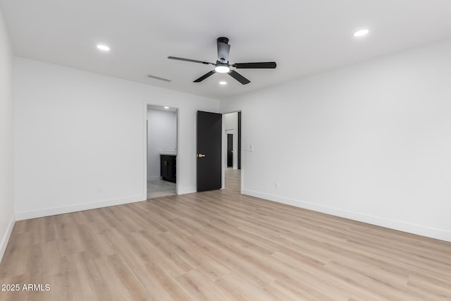 spare room featuring recessed lighting, visible vents, baseboards, and light wood-style floors