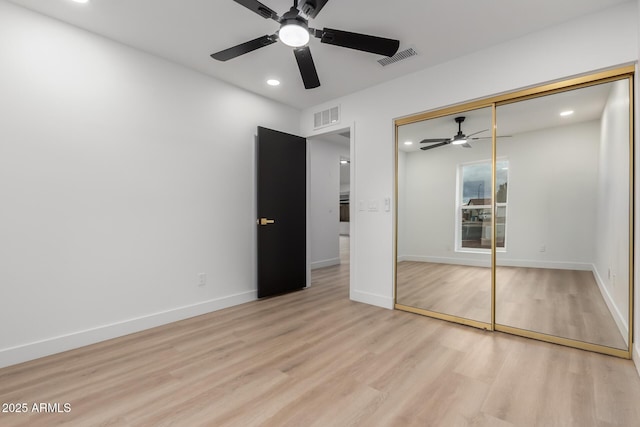 unfurnished bedroom featuring baseboards, visible vents, and light wood-type flooring