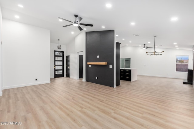 unfurnished living room featuring recessed lighting, baseboards, ceiling fan, and light wood finished floors