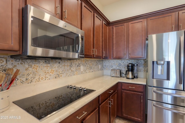 kitchen featuring backsplash and appliances with stainless steel finishes