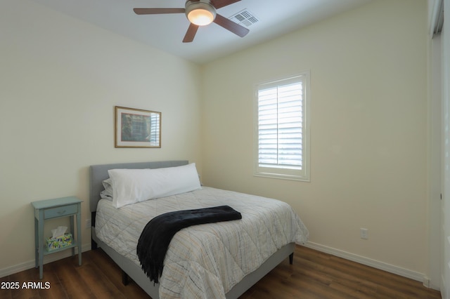 bedroom with ceiling fan and dark hardwood / wood-style flooring