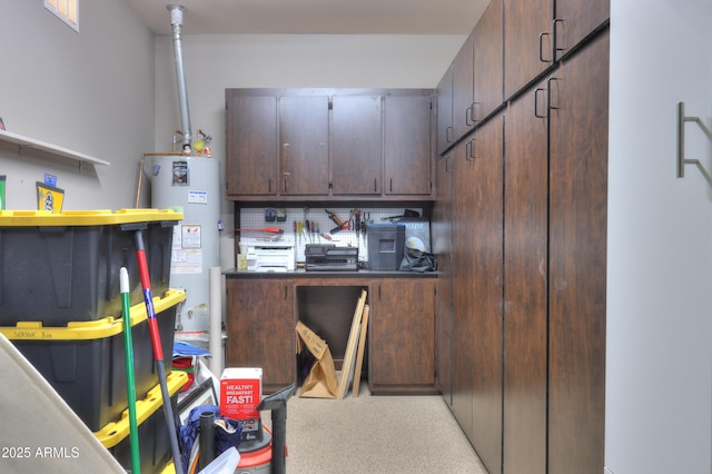 kitchen with dark brown cabinetry and gas water heater