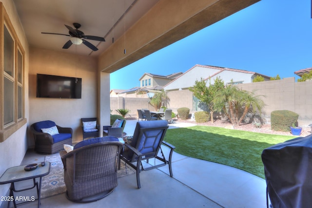 view of patio / terrace featuring ceiling fan, a grill, and an outdoor living space