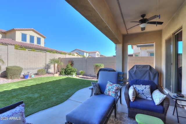 view of patio featuring a grill and ceiling fan