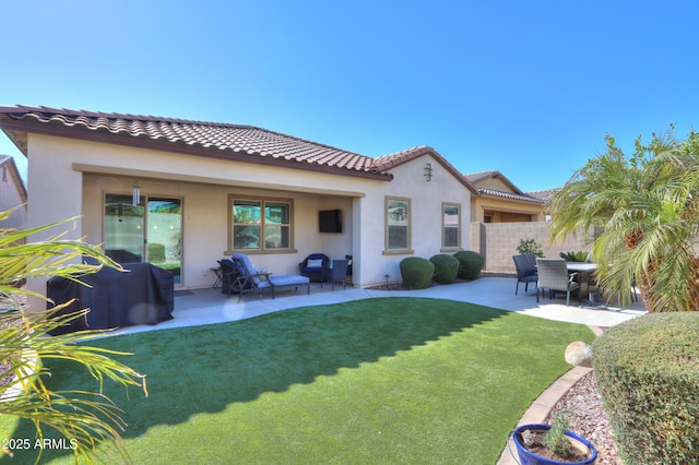 back of house with a yard and a patio area