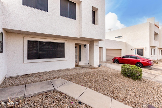 townhome / multi-family property featuring a garage