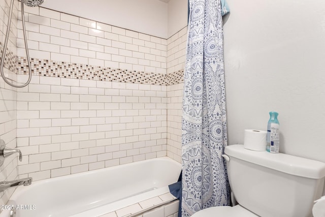 bathroom with shower / tub combo and toilet