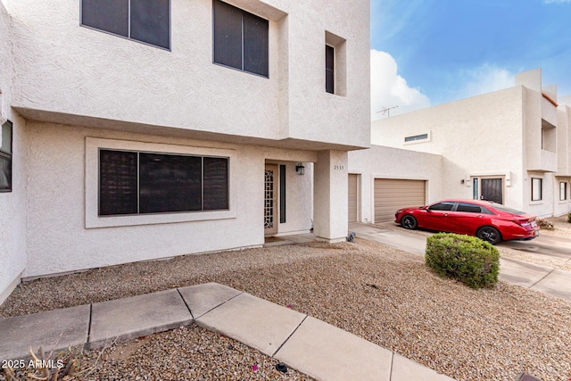 townhome / multi-family property featuring a garage