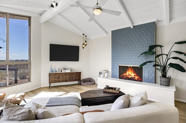 living room with wood ceiling, ceiling fan, vaulted ceiling with beams, wood-type flooring, and a fireplace