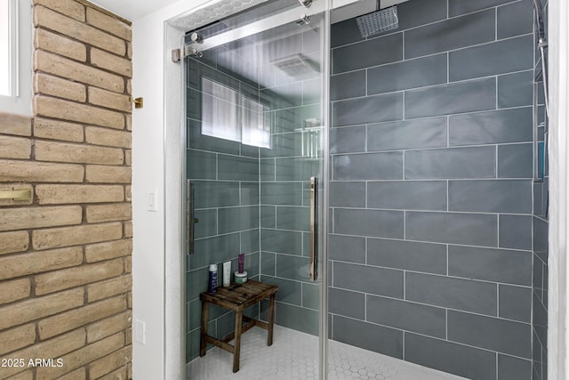 bathroom with a tile shower