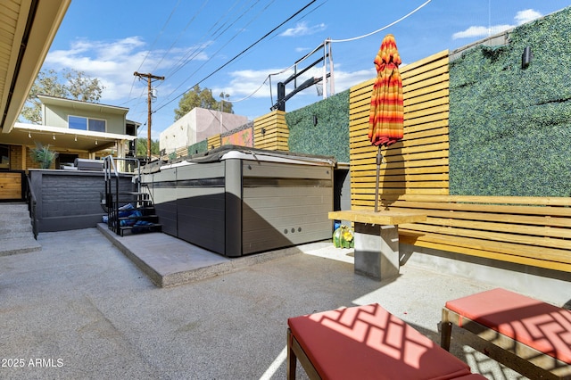 view of patio with a hot tub