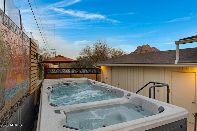 exterior space featuring a hot tub