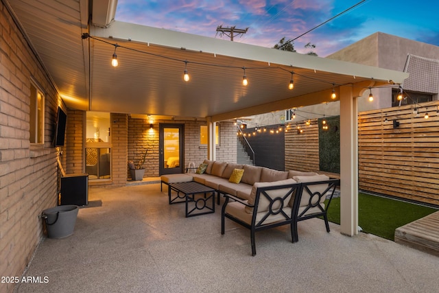 patio terrace at dusk with an outdoor living space