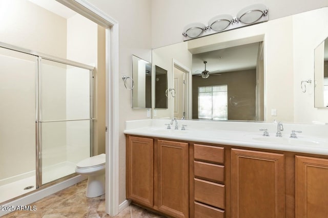 2989 N 44th St N Unit 2007, Phoenix, AZ 85018 - bathroom with toilet, a stall shower, double vanity, and ceiling fan